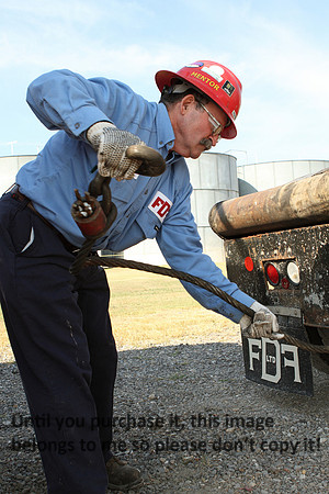 FDF - Equipment Rental Man Unhooking Tank_1712